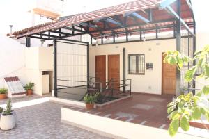 a rendering of a house with a metal roof at Departamentos Ibazeta in Salta