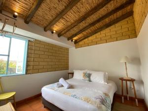 Säng eller sängar i ett rum på Hotel Casa Boutique Villa de Leyva