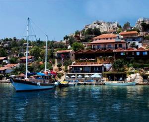 a group of boats docked in a body of water at Deniz Apart in Demre