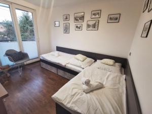 Posteľ alebo postele v izbe v ubytovaní Apartament W SERCU USTRONIA