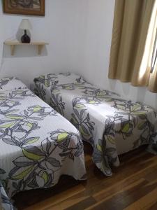 Un pat sau paturi într-o cameră la magia del iguazu