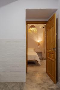 A bed or beds in a room at Casa Santiago House Boutique