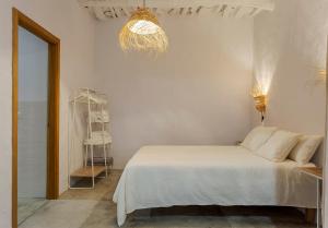 A bed or beds in a room at Casa Santiago House Boutique