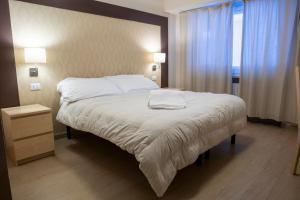Letto o letti in una camera di Hotel Hermitage