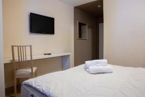 Letto o letti in una camera di Hotel Hermitage
