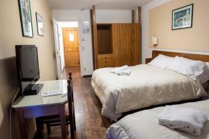 Letto o letti in una camera di Hotel Hermitage