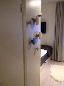 a door with some knobs on it in a room at Avanti Apartment Hotel in Stockholm