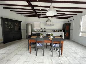 a kitchen with a table and chairs in a room at MULAGUA in Agulo