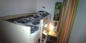 a bunk bed in a room with a staircase at Studio cabine vue mer, piscine panoramique, parking couvert in Cannes +34 photos