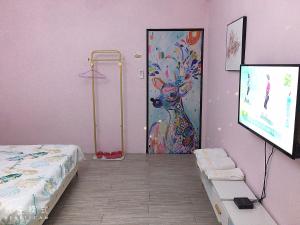 Postel nebo postele na pokoji v ubytování ㄧ個背包客棧