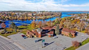 an overhead view of a building with a river and a town at Quality Inn Arnprior in Arnprior
