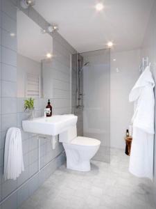 Kylpyhuone majoituspaikassa Avanti Apartment Hotel