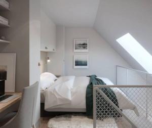 a bedroom with a bed and a desk with a laptop at Avanti Apartment Hotel in Stockholm