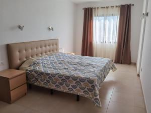 Postel nebo postele na pokoji v ubytování Sun Paradise Apartment
