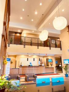 a large lobby with couches and a table at Best Western Plus Lacey Inn & Suites in Lacey