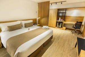 Postel nebo postele na pokoji v ubytování Best Western Plus 93 Park Hotel