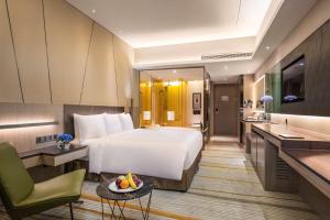 TV a/nebo společenská místnost v ubytování Radisson Blu Shanghai Pudong Jinqiao
