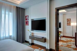 A television and/or entertainment centre at Radisson Blu Hotel, Ajman