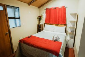 Postel nebo postele na pokoji v ubytování Cochito Cusco