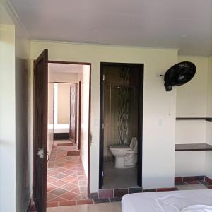 a bathroom with a toilet in a room at BONANZA in Monterrey