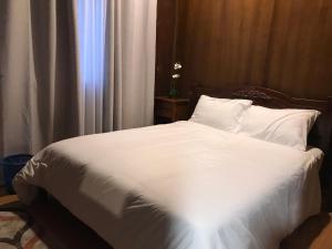 Postel nebo postele na pokoji v ubytování Cinta Abadi Resort