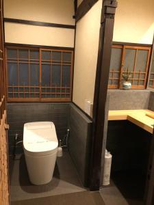 a bathroom with a toilet in a room at KIYOMORI in Hatsukaichi