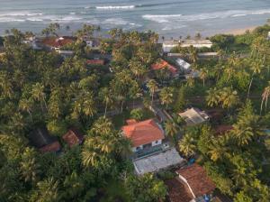 an aerial view of a village with palm trees and the ocean at Idda Private Pool Villa with Staff - 80m to Beach in Ahangama +57 photos