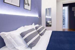 En eller flere senge i et værelse på Pregiata camera con bagno privato - Blu di Persia
