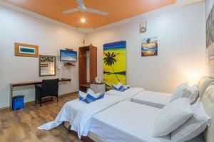 Postel nebo postele na pokoji v ubytování Coral Queen Villa, Ukulhas