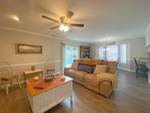 a living room with a couch and a table at Elizabeth Rd House by Palmetto Vacations in Myrtle Beach
