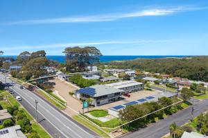 an aerial view of a town with a road and a building at The Harrington Serviced Apartments in Narooma