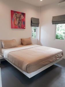 Postel nebo postele na pokoji v ubytování Sunya Cottage