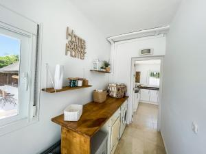 a kitchen with a wooden counter and a window at Sweet Inn - Villa La Sala in Marbella