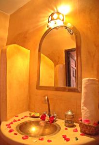 a bathroom with a sink and a mirror at riad Cala Medina in Marrakesh