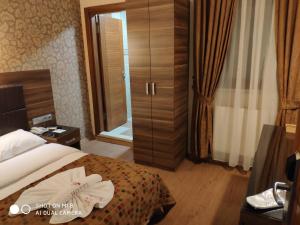 Postel nebo postele na pokoji v ubytování Hotel Bazaar