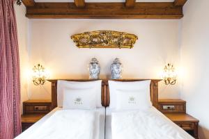 Postel nebo postele na pokoji v ubytování Hotel Bräu