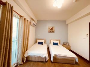 Postel nebo postele na pokoji v ubytování 時光旅舍新館