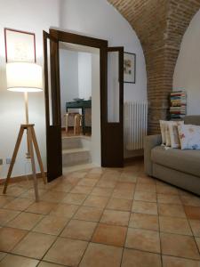 a living room with a couch and a table at Bed and Breakfast In Piazza Orazio in Venosa