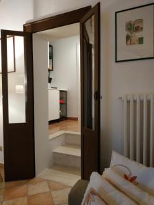 a hallway with a door leading to a stairway at Bed and Breakfast In Piazza Orazio in Venosa