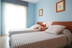 Postel nebo postele na pokoji v ubytování UHC Village Park Apartments