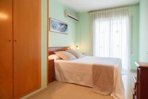 Postel nebo postele na pokoji v ubytování UHC Village Park Apartments