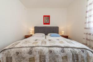 Postel nebo postele na pokoji v ubytování Apartments Roje