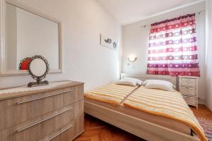 Postel nebo postele na pokoji v ubytování Apartments Roje