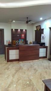 an empty lobby with a cash register in a store at Vels Residency in Puducherry