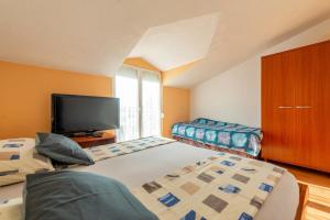 Postel nebo postele na pokoji v ubytování Apartments Roje