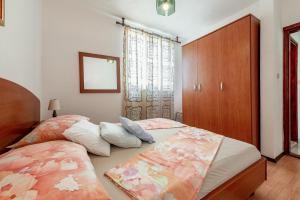 Postel nebo postele na pokoji v ubytování Apartments Roje