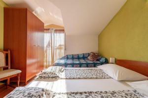 Posteľ alebo postele v izbe v ubytovaní Apartments Roje
