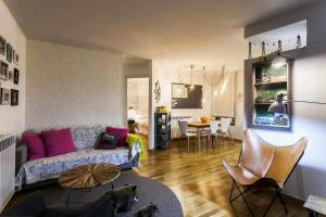 a living room with a couch and a table at UP BENASQUE Borda Albar in Benasque