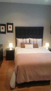 Un pat sau paturi într-o cameră la Cubelas Porto do Son