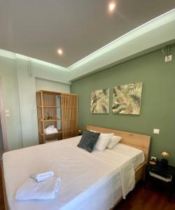 Postel nebo postele na pokoji v ubytování ASIMINA apartment, Kerameikos Metro Station